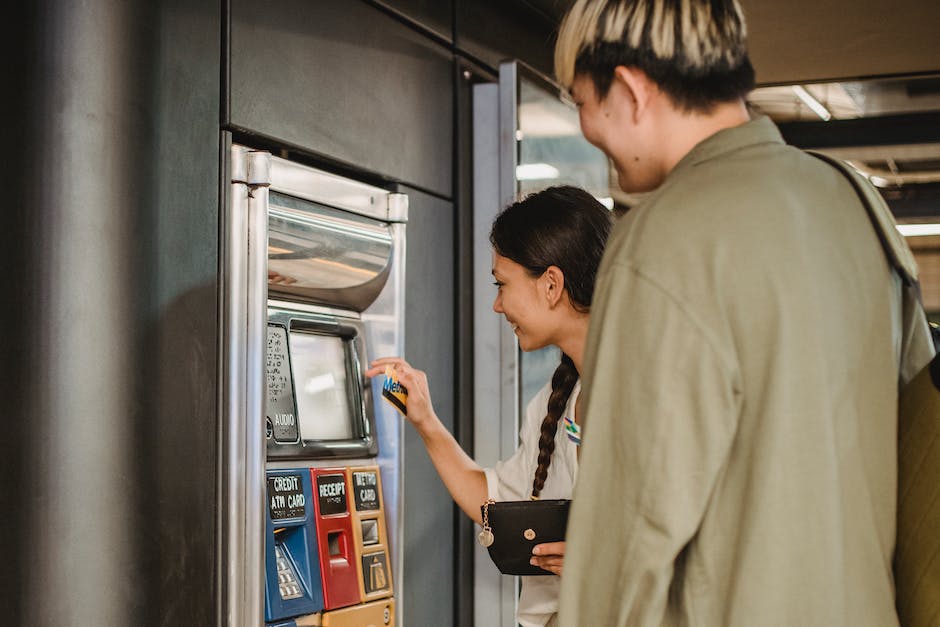 inserting money into vending machines