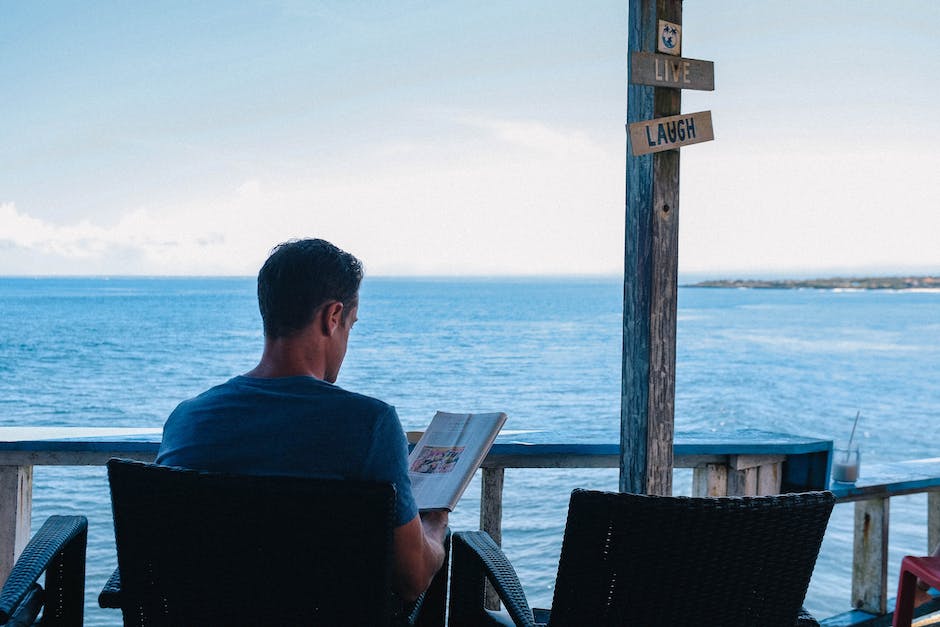 man reading reviews of vacation rentals