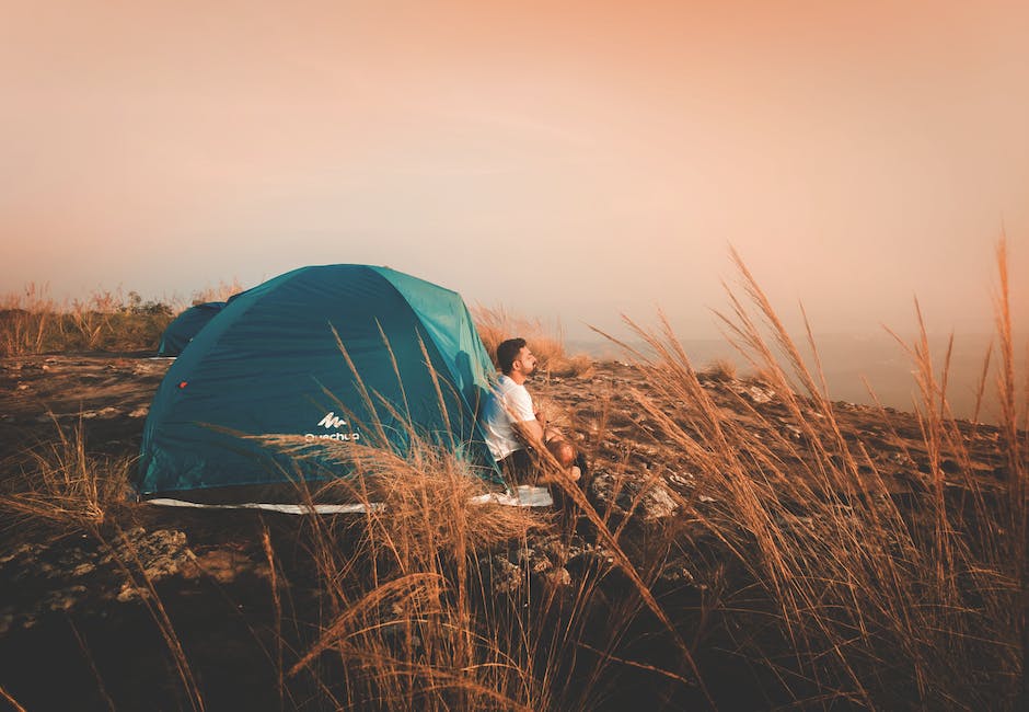 solo traveler camping in historic-style tent