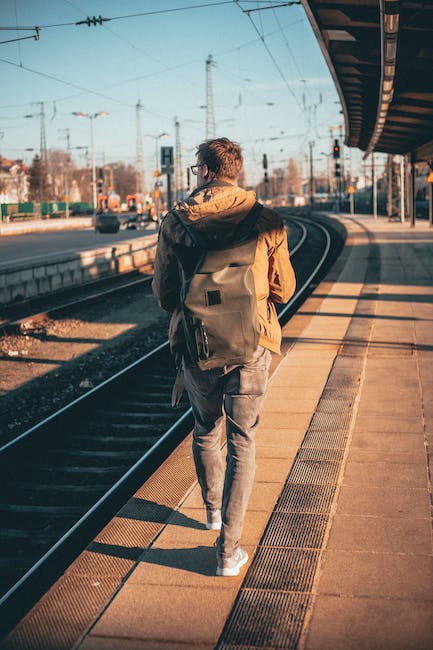 solo traveler with backpack on commuter train