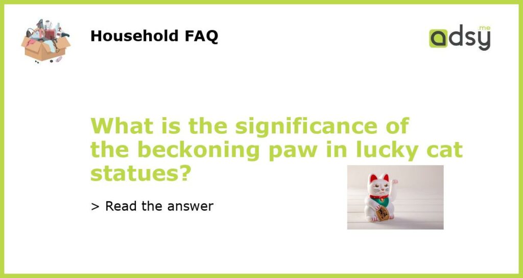 What is the significance of the beckoning paw in lucky cat statues featured